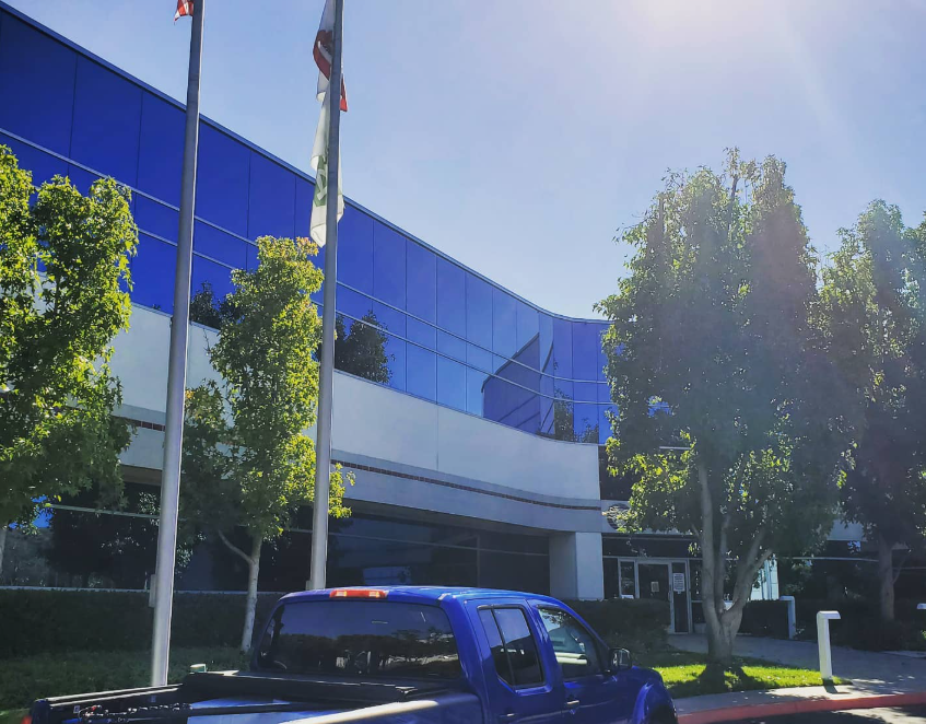 Image of Newport Beach office building with freshly cleaned mirrored windows.